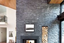 living room with a faux stone wall