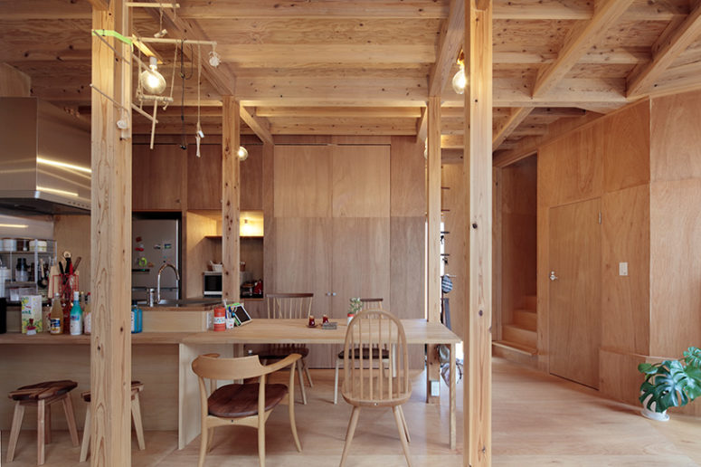 Everything is clad with wood, there are bulbs instead of lamps and the furniture is wooden, too