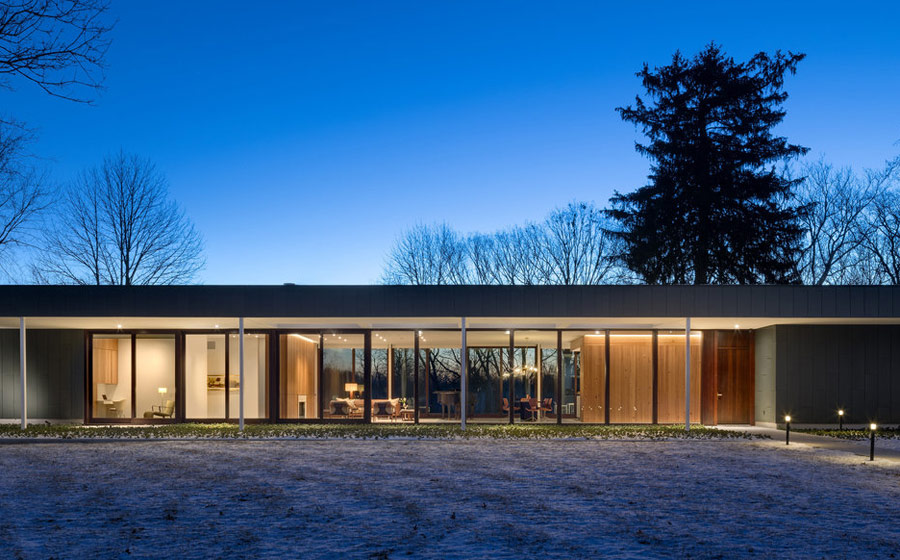 The home is long and low, it's extensively glazed to bring much light inside