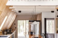 open space with exposed wooden beams