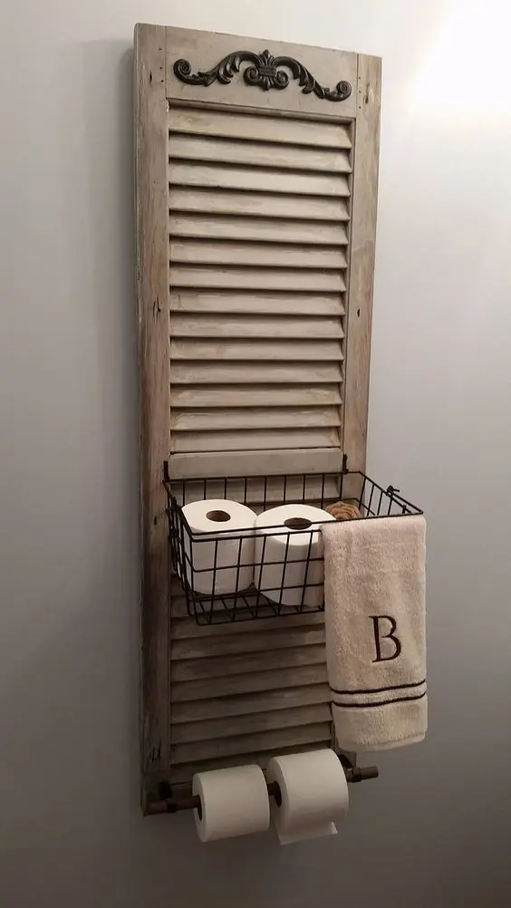 a bathroom shelf made of an old shutter and a metal basket is an easy DIY project