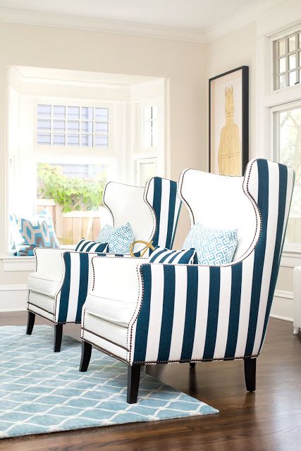 classic cream and vertical stripe chairs are a nice idea for a nautical interior