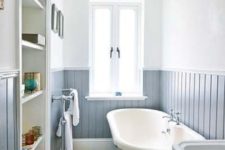 07 a chic bathroom with a rustic feel and powder blue wainscoting that adds an ethereal feel