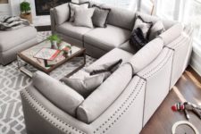 07 a stylish dove grey L-shaped sectional sofa with a matching ottoman as a basic piece for a living room