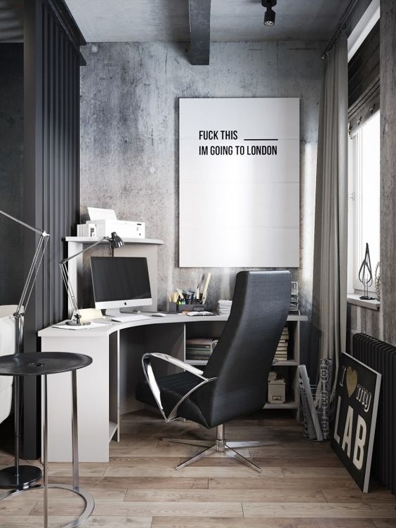an oversized black and white artwork in an industrial office motivates to go on holiday