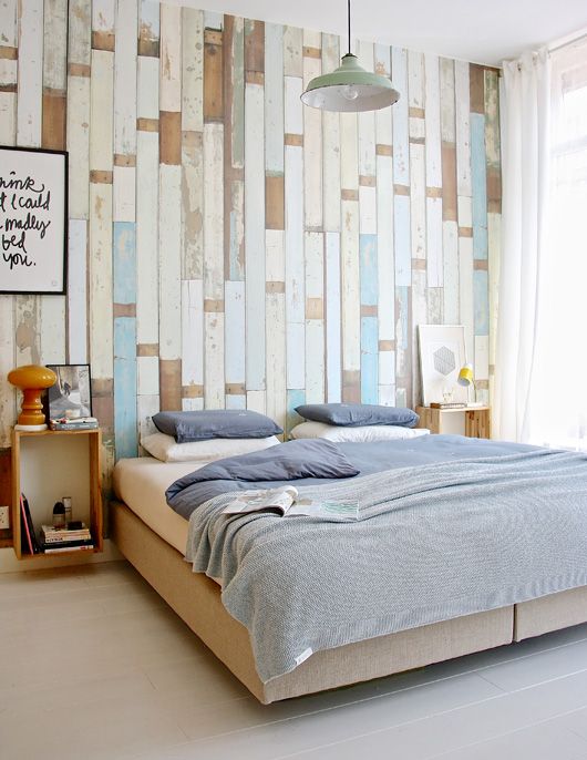 colorful wallpaper accent wall imitates shabby chic and aged pallet wood