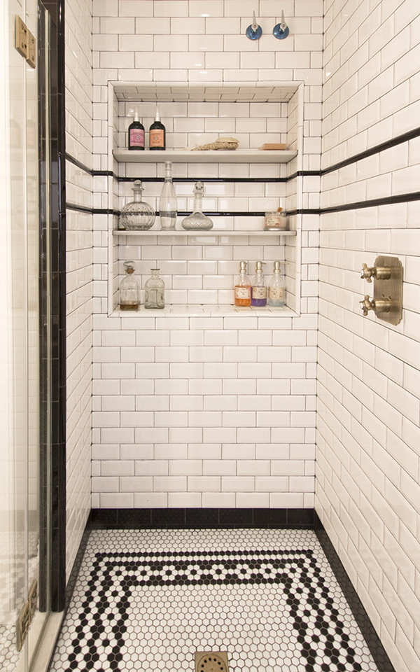 A built-in shower shelf with wine storage, yes, please