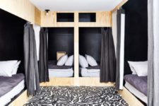 09 The guest bedroom is done in a creative way, there are four beds with curtains to achieve some privacy