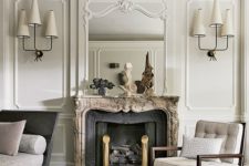 10 a creamy living room with molding, an antique fireplace and edgy designer’s furniture and lamps