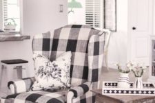 farmhouse-style interior with a wingback chair