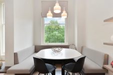 11 a tiny dining space features built-in banquettes and a rounded table that don’t make the space feel small