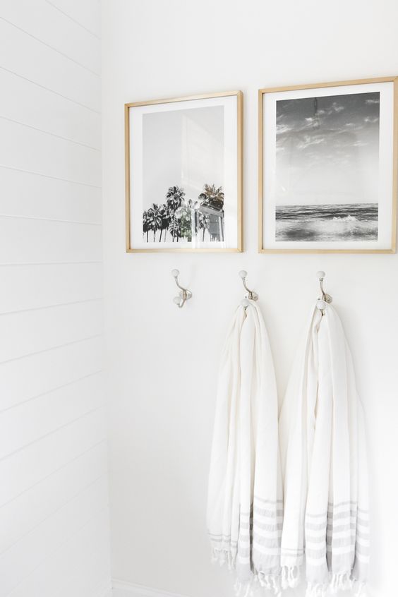 your personal photos in frames can be used to decorate a bathroom and make it cozier