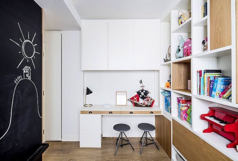 The second kids' space features a chalkboard and lots of storage shelves plus a space for creating