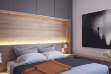 12 a contemporary bedroom with a floating bed, a lit up headboard and a large artwork