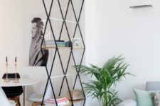13 a catchy geometric shelf can hold some items and separate the dining and living spaces subtly