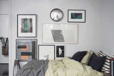13 a large and bold asymmetrical gallery wall is a great accent feature for the bedroom