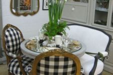 13 a refined dining space with buffalo check chairs and a black and white bench for a French country feel
