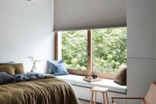 13 a textural Roman shade adds interest to the bedroom while keeping it private enough