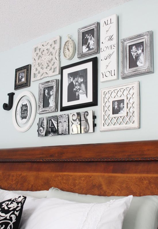 a vintage-inspired gallery wall with personal photos and signs