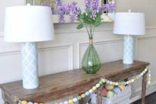 egg garland used to decorate a console table