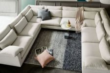 15 an oversized creamy U-shaped sectional sofa is a great conversation pit base to go for