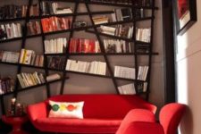16 a large asymmetrical bookshelf that takes the whole wall is a bold feature that makes you drop your jaw