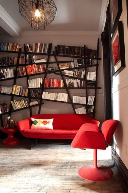 a large asymmetrical bookshelf that takes the whole wall is a bold feature that makes you drop your jaw