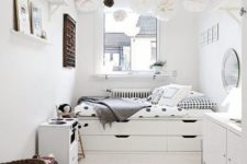 16 a serene Scandinavian space done with a bed with built-in storage drawers is a great idea