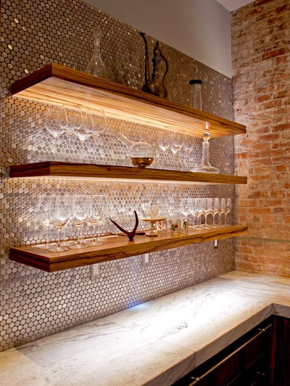 a copper penny tile backsplash and lit shelves for the home bar space