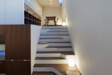 17 an asymmetric staircase is a great way to add a special feature to your space without being excessive