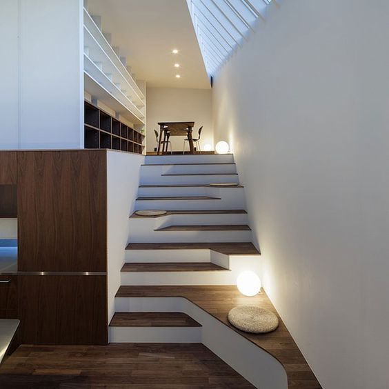 an asymmetric staircase is a great way to add a special feature to your space without being excessive