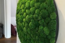 17 an oversized circle moss art piece is a bold and interesting decoration
