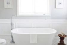 17 protect the walls of your bathroom next to the bathtub with elegant wainscoting, which is ideal for a glam space