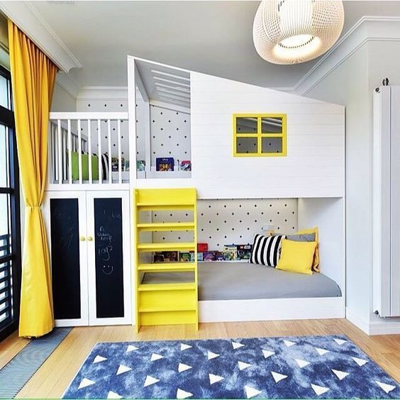 yellow touches and some blue ones make the room cheerful, and chalkboard doors and a polka dot wall add interest