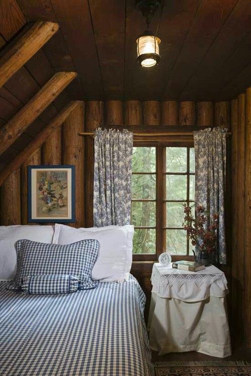 a country attic bedroom with a bed in the corner and a nightstand - nothing else is here to declutter the room