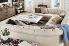 18 an elegant space with a rustic feel and a gorgeous U-shaped tufted sofa of creamy color that makes it more refined