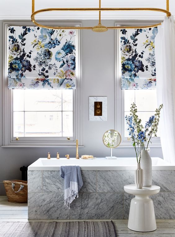 bold blue floral printed Roman shades add style to the bathroom and make it feel like summer