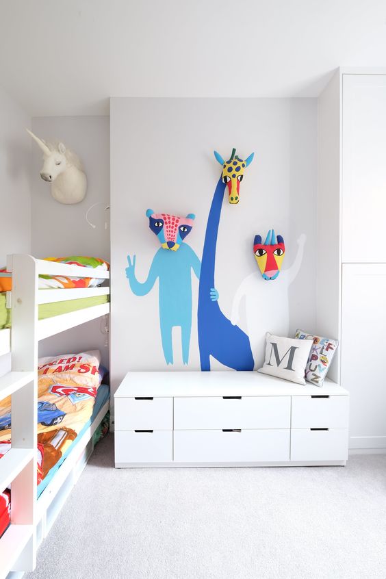 color is added with bold bedding and some bold animals painted on the wall
