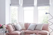 18 light grey Roman shades make the room more peaceful and tranquil