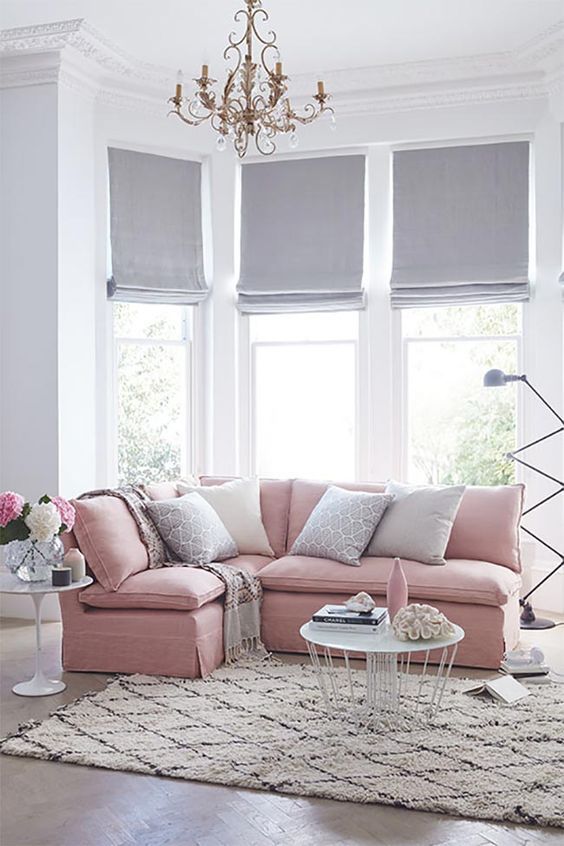 light grey Roman shades make the room more peaceful and tranquil