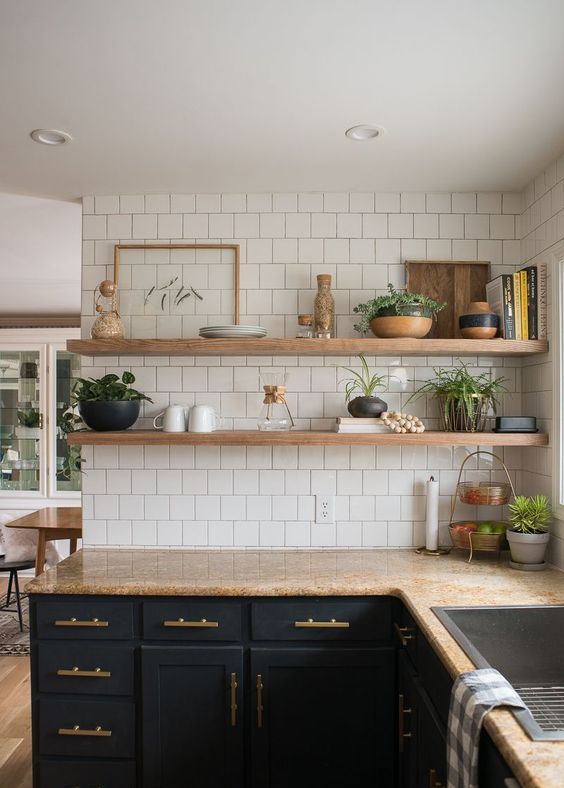 a modern farmhouse kitchen with open floating shelves that match the countertops