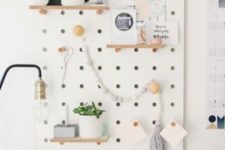 19 a white pegboard with shelves is a great piece that will accomodate a lot of things