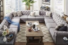 19 an oversized U-shaped grey tufted sofa makes a perfect fit for this unusually shaped living room