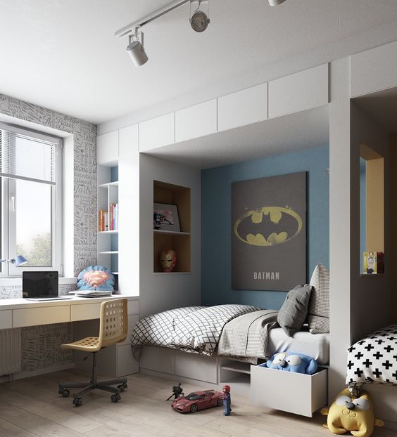 a super hero themed room with a Batman poster and an Iron Man mask plus Superman-inspired touches