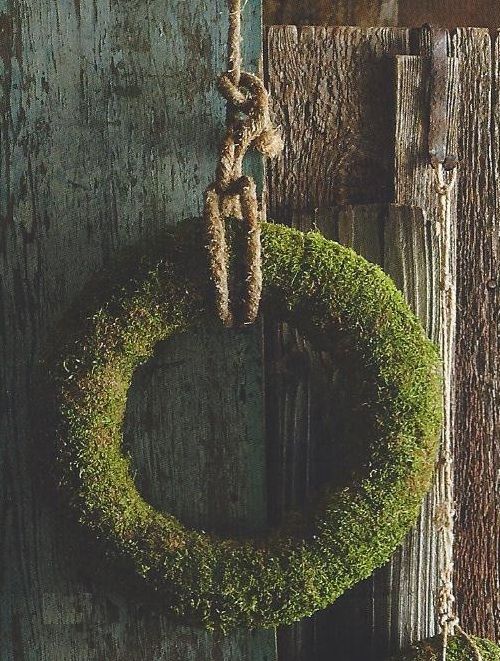 a large moss wreath with rope will add a raw rustic touch to the space