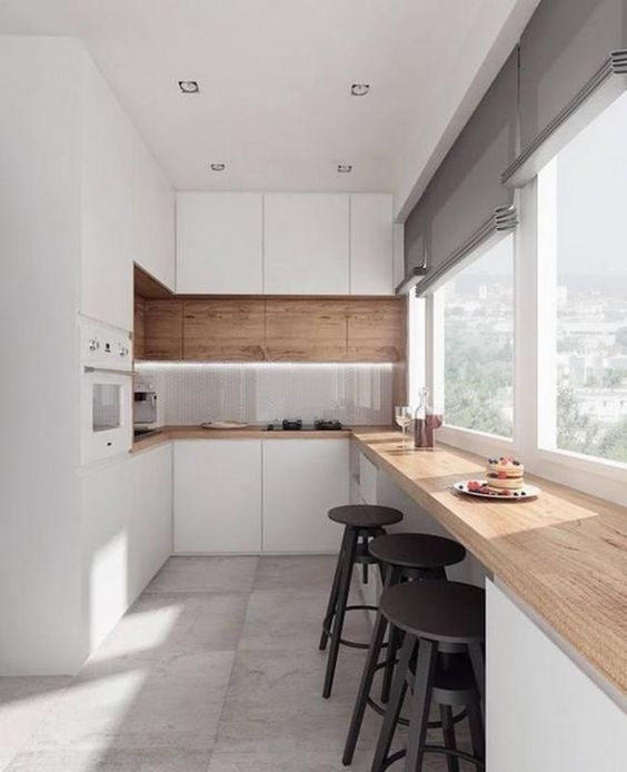 a sleek minimalist kitchen with a breakfast windowsill space