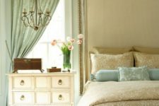 21 an asymmetrical mint-colored curtain is echoed in the pillows of the same shade