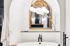 21 go for a stylish framed mirror in your bathtub niche for an elegant touch