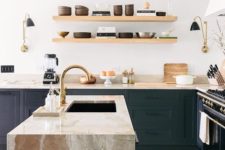 21 modern wooden shelves and eye-catchy stone surfaces make this kitchen very stylish