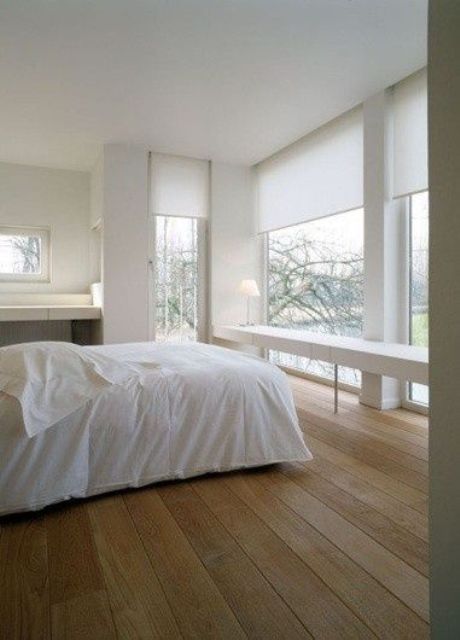 white semi sheer Roman shades will help to keep privacy in the bedroom and don't spoil the harmony of the room